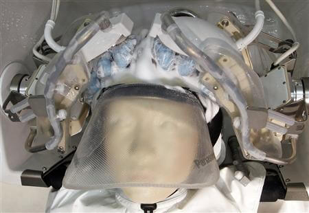 Panasonic's hair-washing robot washes hair on a mannequin at a demonstration in Tokyo