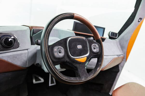 Два в одном. Бывший главный дизайнер BMW представил REDS: электрокар и передвижной офис. Фото.