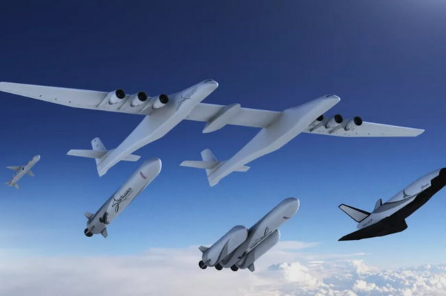 Компания Stratolaunch в довесок к самому большому самолету создаст три ракеты и космоплан. Фото.