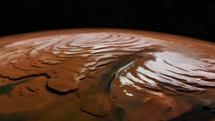 Под поверхностью северного полюса Марса обнаружены огромные запасы водного льда. Фото.