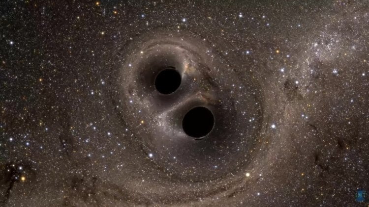 Черные дыры помогают галактикам эволюционировать. Так выглядит столкновение двух сверхмассивных черных дыр. Фото.
