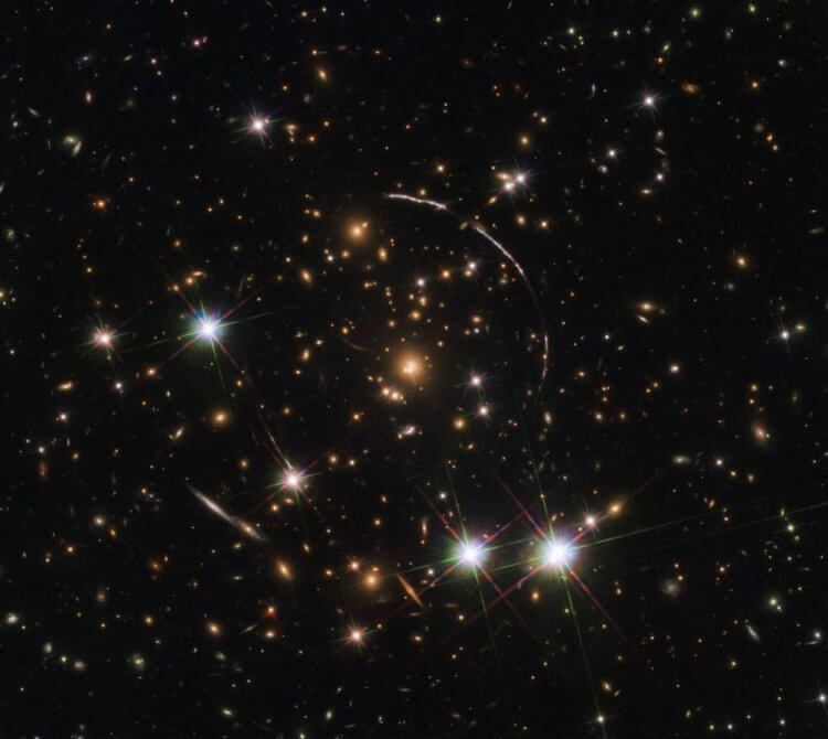 Что такое темные века Вселенной? Галактика Sunburst Ark. Фото.