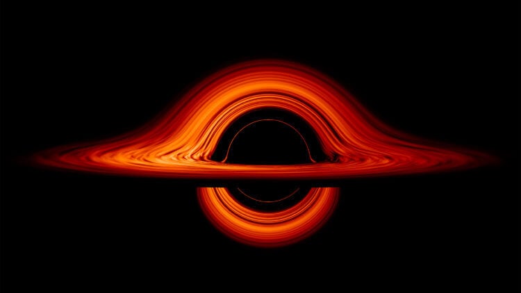 Масса, угловой момент и электрический заряд черной дыры. Так выглядит смоделированная визуализация черной дыры, представленная NASA. Фото.