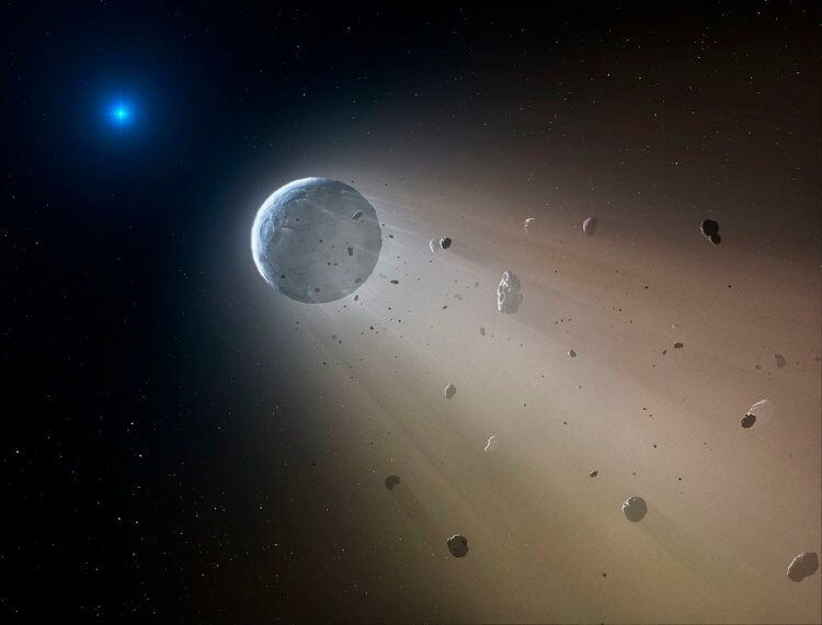 WD 1145+017 - звезда в созвездии Девы. Расстояние от Земли около 570 световых лет. Это означает, что то что мы видим сейчас в телескопы, происходило со звездой 570 лет назад. Путешествие в прошлое, не иначе! В 2015 году астрономы заметили, что WD 1145+017 тускнеет с нерегулярной скоростью, а после пристального изучения поняли, что звезда пожирает планеты в своей солнечной системе через процесс, называемый вспышкой приливного разрушения – когда звезда приближается к горизонту событий сверхмассивной черной дыры и ее разрывает приливными силами, путем “спагеттификации”. Подробнее о том, что это такое и почему попав в черную дыру вы тоже превратитесь в спагетти, читайте в нашем материале. Примечательно, что потребовалось целых пять лет чтобы исследование было принято на рецензирование в The Astrophysical Journal. Все это время работа находилась в открытом доступе на сервере препринтов в arXiv. Белые карлики выглядят так Белый карлик - если простыми словами, то это звезда лишенная источников термоядерной энергии. По сути, она просто остывает и тускнеет, как недавно отключенная конфорка электрической плиты Прямо перед тем, как стать сверхновой или превратиться в черного карлика, умирающие звезды становятся белыми карликами. Такая участь ждет и наше Солнце, но к счастью, не раньше чем через шесть миллиардов лет. Белые карлики лишены источников термоядерной энергии и светятся слабо, постепенно остывая и краснея. Атмосферы таких звезд обычно содержат более легкие элементы, например гелий и водород. Именно благодаря изучению атмосферы WD 1145+017 астрономы поняли, что обнаруженный ими белый карлик ведет себя несколько необычно: яркость звезды уменьшалась на разные значения каждые 4,5-5 часов, а в ее атмосфере были обнаружены следы элементов, которые обычно встречаются в ядрах скалистых планет – железо, кислород и магний. Вам будет интересно: Расплетая радугу – как тайны света привели человечество к открытию темной материи? Чтобы выяснить, как планеты встретили свою гибель, исследователи создали серию компьютерных симуляций, на которых отображалось как 36 различных типов планет отреагировали бы на поглощение родной звездой. Результаты показали, что чаще всего именно скалистые планеты выдерживали основной этап разрушения, но распадались в течение короткого периода времени. Важно понимать, что все описываемые процессы длились тысячи лет. Причина, по которой вокруг белого карлика WD 1145+017 не было обнаружено мелких объектов, заключается в том, что все обломки планет поглощает чудовищная сила гравитации. Остатки планет теряют массу и форму – по этой причине яркость звезды тускнеет. Еще больше увлекательных статей о нашей удивительной Вселенной и ее обитателях читайте на нашем канале в Яндекс.Дзен Изучая останки каменистых планет можно разгадать тайны галактик и Вселенной Таким образом некропланетология убивает сразу двух зайцев – с ее помощью ученые могут одновременно изучать гибель белых карликов и планет, постепенно восстанавливая хронологию событий и то, как происходит эволюция звездных систем. Так, только за прошлый год было открыто более 20 умирающих звездных систем, в каждой из которых останки погибших планет хранят в себе ценнейшую информацию. Это стало возможным, так как астрономы объяснили аналогичное поведение других звезд, что в прошлом вызывало горячие споры в академической среде. Оказалось, звезды были просто мертвыми, а окружающие их космические тела, сформированные гравитацией, создавали эффект затемнения свечения. Вот так, изучая останки погибших планет исследователи узнают об их темпах разрушения. В будущем восстановление их прежнего облика позволит моделировать целые звездные системы, в которых родились эти далекие миры, а также заглянуть в прошлое галактик. В конечном итоге череда будущих открытий позволит лучше понять устройство нашей Вселенной. Кстати, несмотря на свое название, область некропланетологии сегодня процветает и это не может не радовать. Изучая останки каменистых планет можно разгадать тайны галактик и Вселенной. Фото.