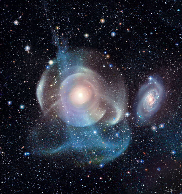Галактика NGC474. Открыта Уильямом Гершелем в 1784 году. Многочисленные светящиеся оболочки показывают неожиданно сложную структуру этой галактики. Фото.