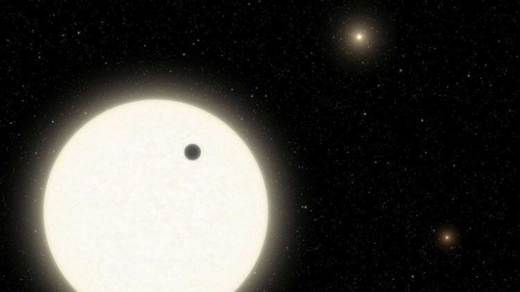 Обнаружена экзопланета с тремя солнцами. Так в представлении художника выглядит экзопланета KOI-5Ab в созвездии Лебедя, расположенную в системе из трех звезд, похожих на Солнце. Фото.