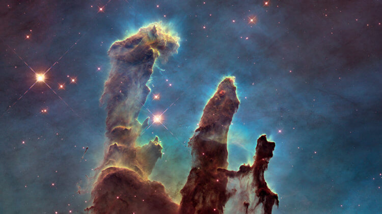 Что увидел телескоп Джеймс Уэбб. Перед вами скопления межзвездного газа и пыли в туманности Орел, расположенной примерно в 7000 световых лет от Земли,. Фото.