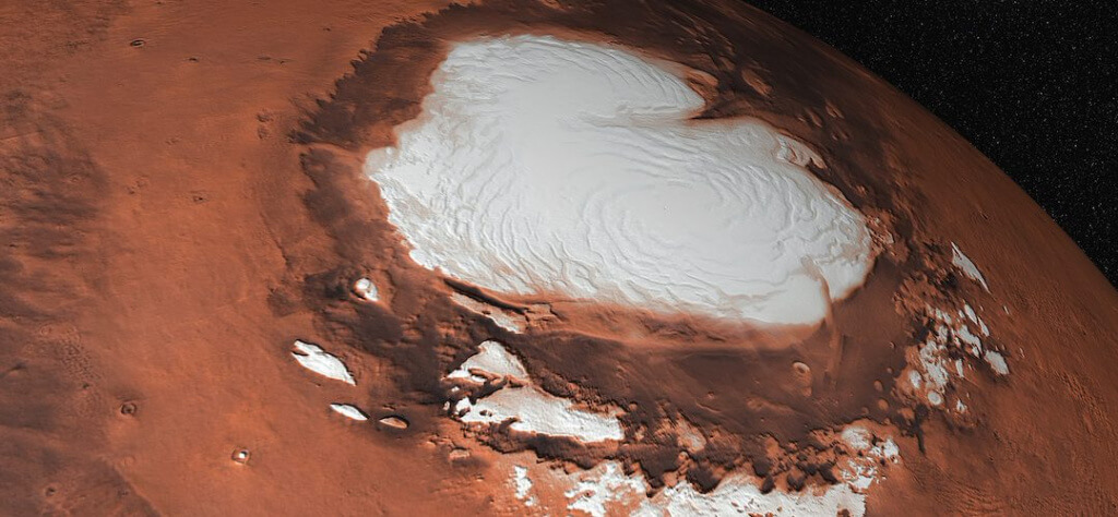 Откуда взялась вода Марсе. Несколько миллионов лет назад вода активно испарялась из ледяной шапки Марса. Фото.