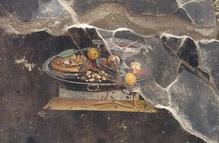 В Помпеях обнаружена новая фреска. Фреска с прообразом современной пиццы. Источник: IFL Science. Фото.