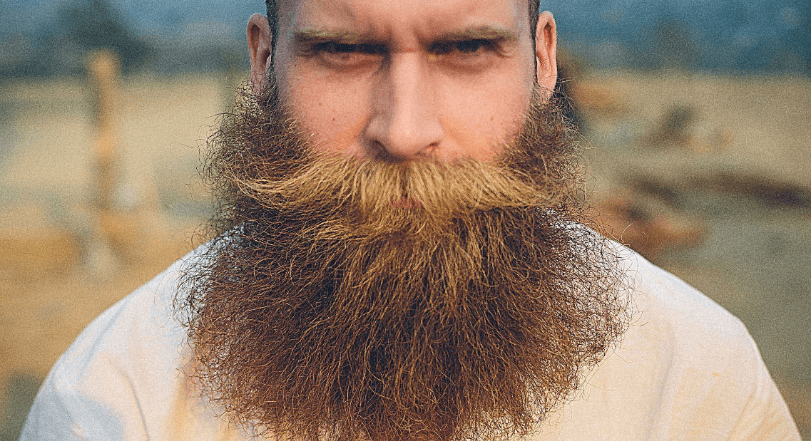 Почему высота голоса влияет на восприятие статуса человека. В разных обществах мужские черты, включая бороду и низкие голоса, имеют разное значение. Фото.