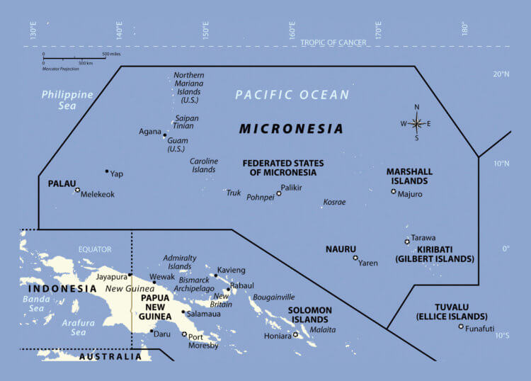 People on a desert island. The location of Micronesia on the map. Source: geography.name. Photo.
