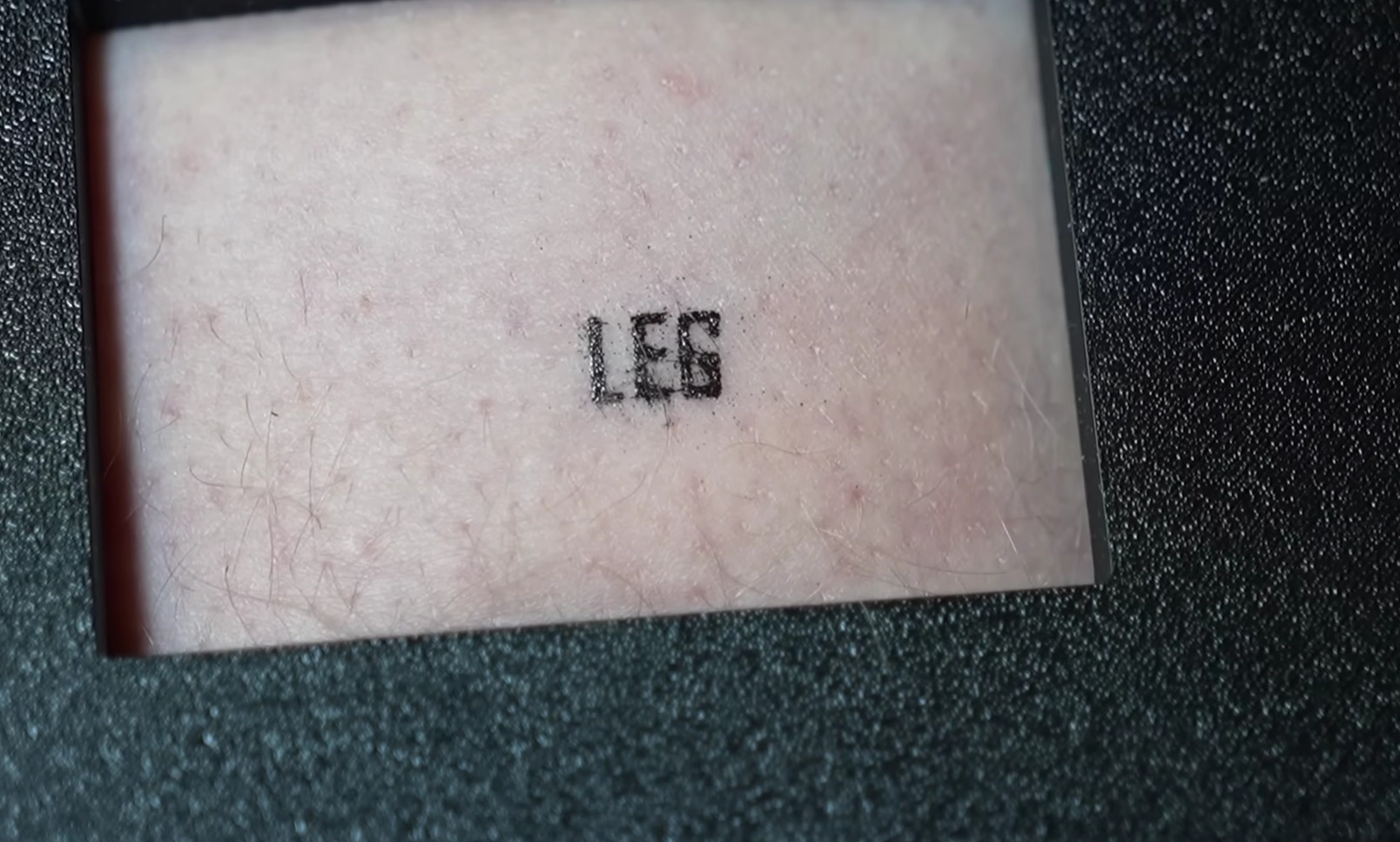 Tattooing with a 3D Printer. The DIY 3D printer managed to print a word. Photo.