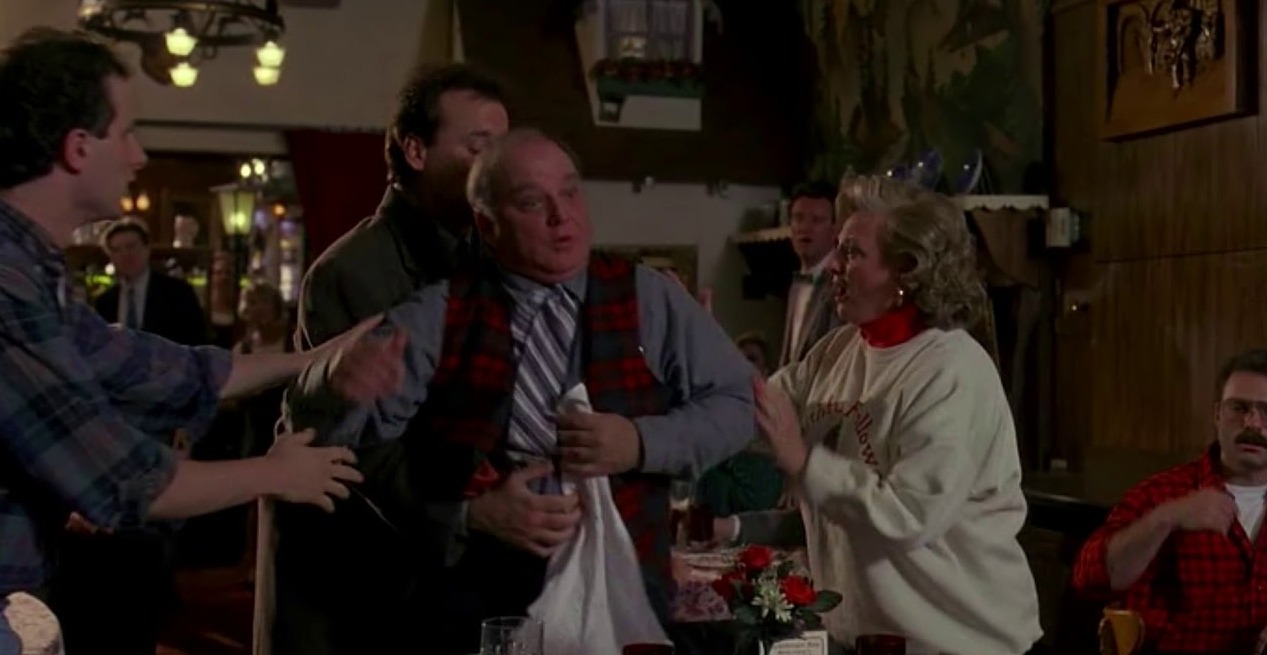 What to Do If Someone Is Choking: The Heimlich Maneuver Can Save a Life. Scene from the movie 'Groundhog Day'. Photo.