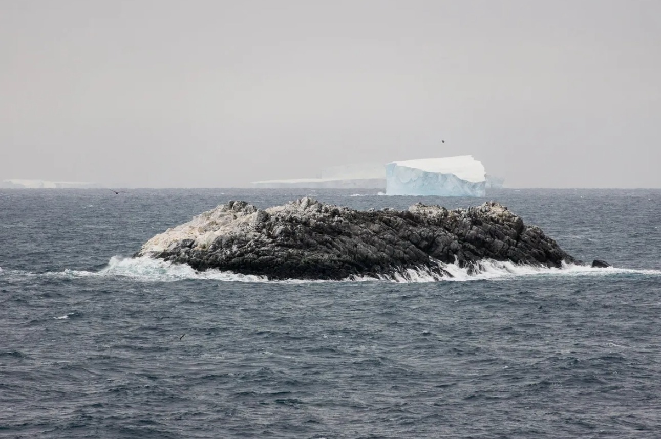 Up close, the island doesn't look much like an iceberg, but from space… Image source: IFL Science. Photo.